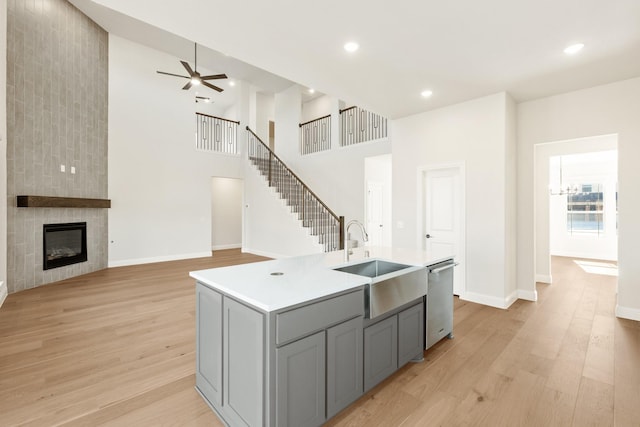 2302 Prosper Way, Mansfield, TX 76063 - kitchen with light countertops, dishwasher, a sink, light wood-type flooring, and gray cabinets