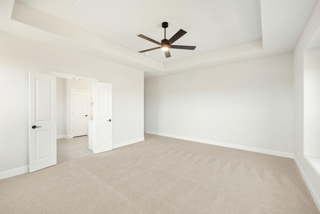 2302 Prosper Way, Mansfield, TX 76063 - empty room with light colored carpet, ceiling fan, baseboards, and a raised ceiling