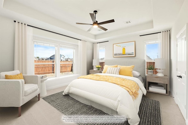 2302 Prosper Way, Mansfield, TX 76063 - carpeted bedroom with a ceiling fan, a raised ceiling, and visible vents