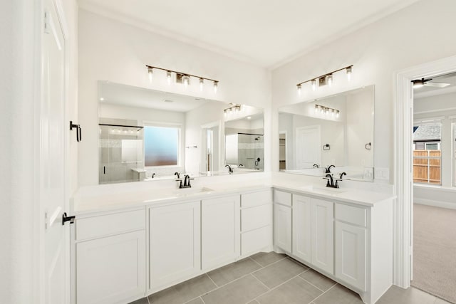 2302 Prosper Way, Mansfield, TX 76063 - bathroom with a stall shower, a sink, double vanity, and tile patterned floors