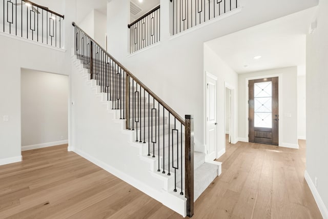 2302 Prosper Way, Mansfield, TX 76063 - foyer with baseboards, a high ceiling, wood finished floors, and stairway