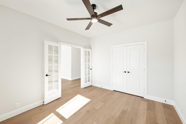2302 Prosper Way, Mansfield, TX 76063 - unfurnished bedroom with baseboards, a closet, light wood-style floors, and french doors