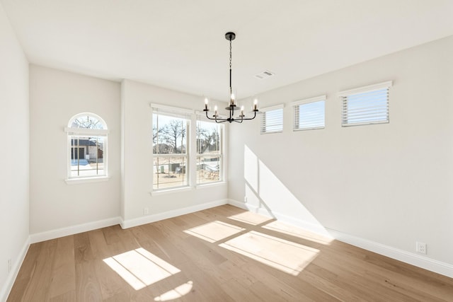 2302 Prosper Way, Mansfield, TX 76063 - unfurnished dining area with baseboards, visible vents, light wood-style floors, and a notable chandelier