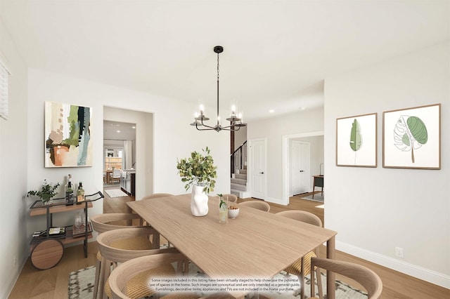 2302 Prosper Way, Mansfield, TX 76063 - dining room featuring baseboards, wood finished floors, recessed lighting, stairway, and a notable chandelier
