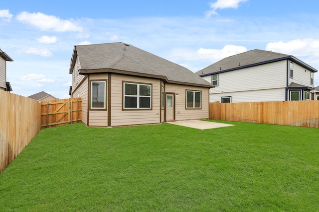 back of property featuring a patio area and a yard