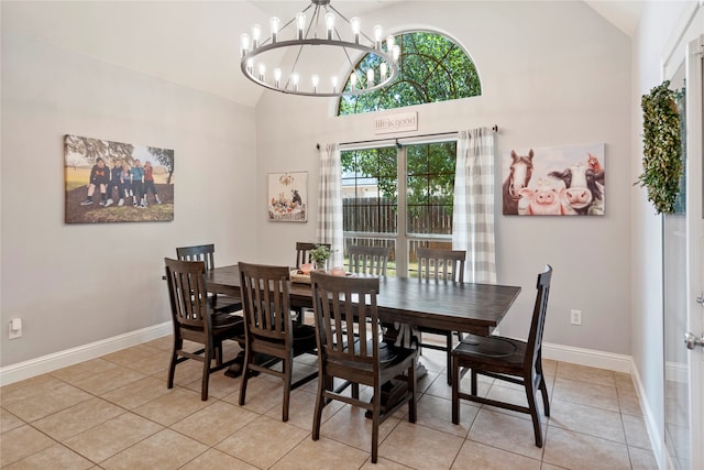 dining space featuring a wealth of natural light, light tile patterned flooring, high vaulted ceiling, and a notable chandelier