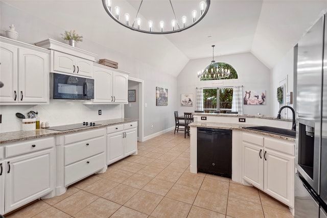 kitchen featuring black appliances, white cabinets, sink, hanging light fixtures, and light tile patterned flooring