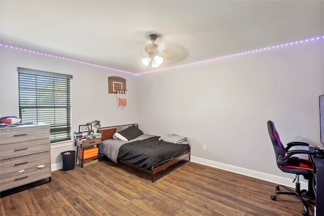 bedroom with ceiling fan and dark hardwood / wood-style flooring