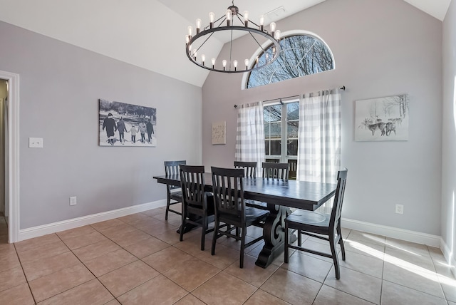 dining area featuring light tile patterned flooring, high vaulted ceiling, and a chandelier