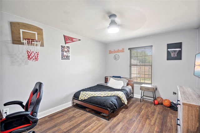 bedroom with ceiling fan and dark wood-type flooring