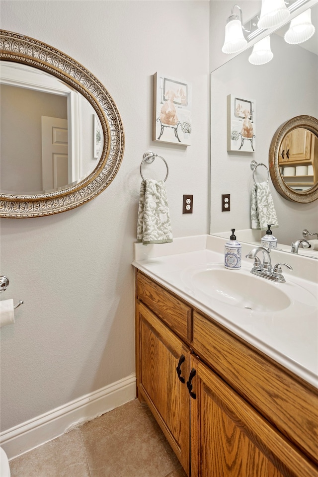 bathroom with tile patterned flooring and vanity