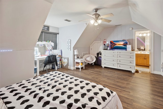 bedroom featuring ceiling fan, dark hardwood / wood-style flooring, lofted ceiling, and ensuite bath