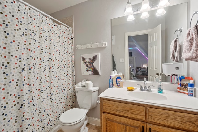 bathroom with tile patterned floors, vanity, toilet, and a shower with shower curtain