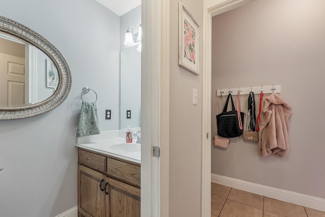 bathroom with tile patterned flooring and vanity