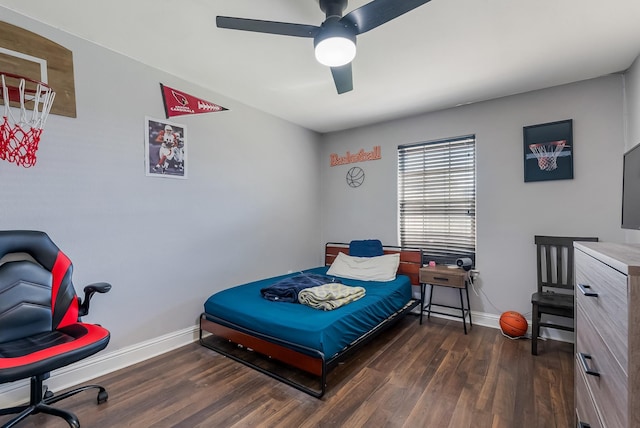 bedroom with dark hardwood / wood-style floors and ceiling fan