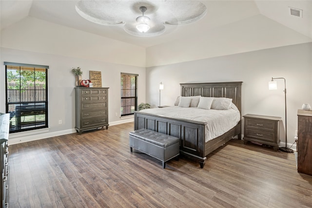 bedroom with hardwood / wood-style floors, ceiling fan, and lofted ceiling