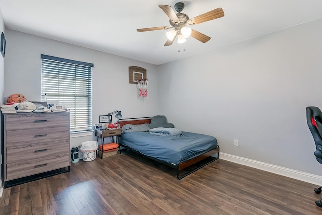 bedroom with dark wood-type flooring and ceiling fan