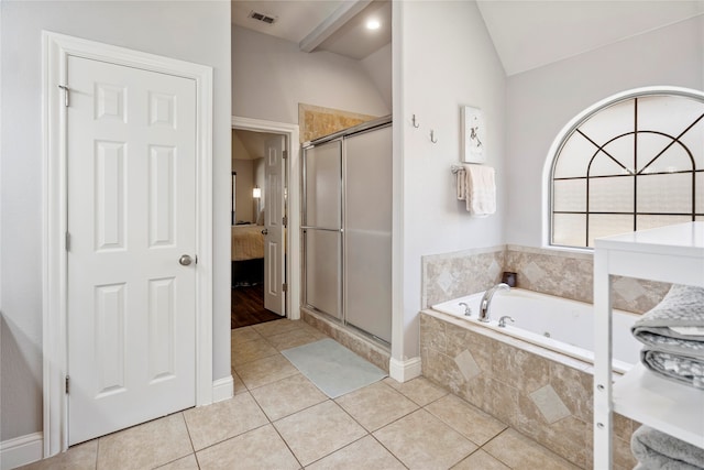 bathroom featuring tile patterned flooring, independent shower and bath, and lofted ceiling