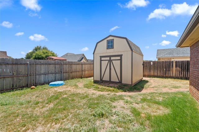 view of outdoor structure featuring a lawn