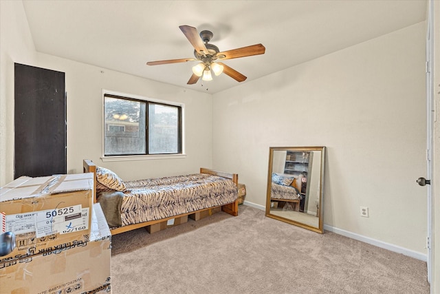 bedroom with light colored carpet and ceiling fan