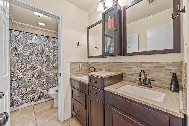 bathroom with tasteful backsplash, ornamental molding, vanity, toilet, and tile patterned floors