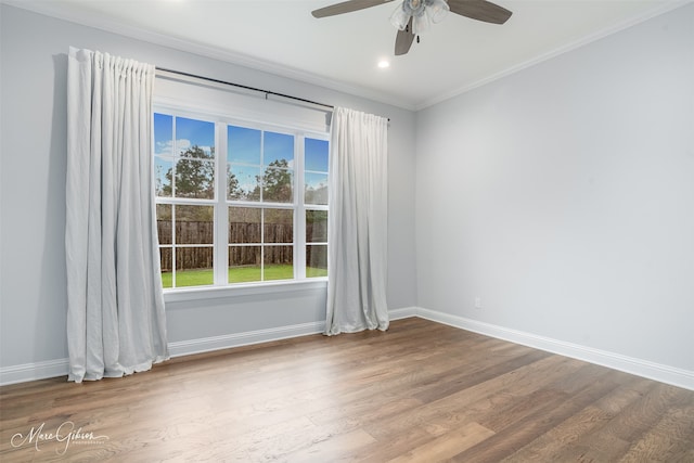 spare room with hardwood / wood-style flooring, ceiling fan, and ornamental molding