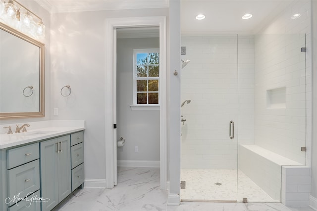 bathroom with vanity, an enclosed shower, and ornamental molding