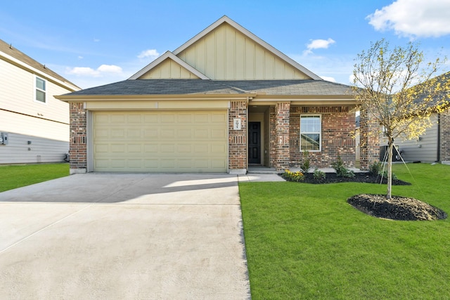 view of front of property featuring a garage and a front lawn