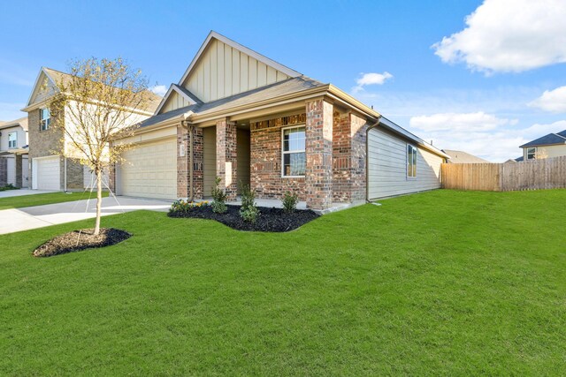 view of front of home featuring a garage and a front lawn