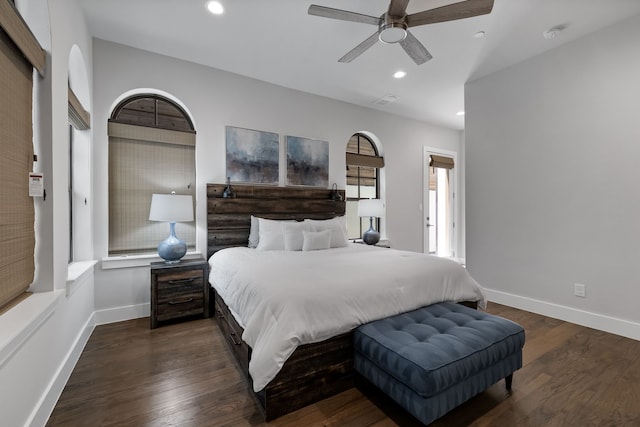 bedroom with ceiling fan and dark wood-type flooring