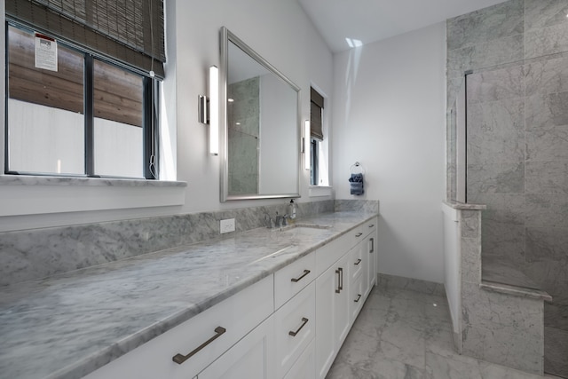 bathroom featuring vanity and tiled shower