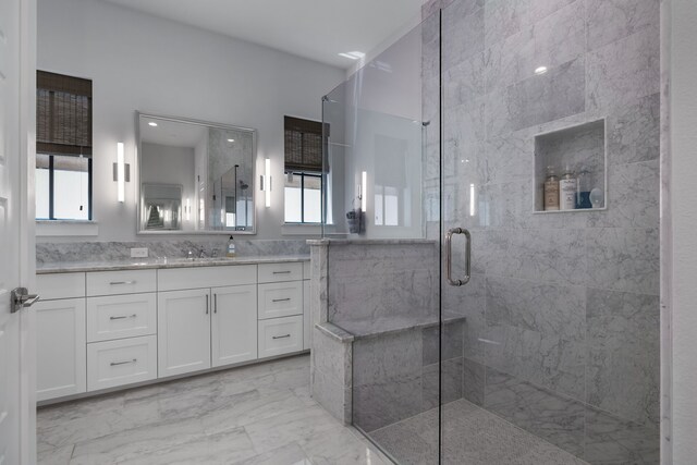 bathroom with tile patterned floors, vanity, and an enclosed shower