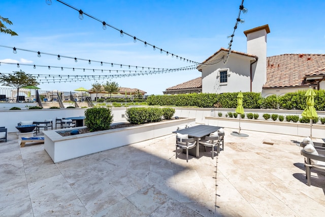 view of patio featuring a fire pit