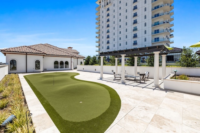 view of community with a pergola and a patio