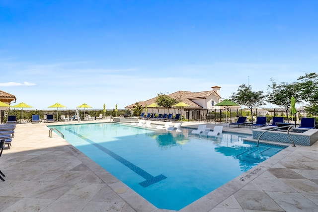 view of swimming pool with a patio area