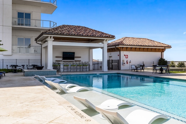 view of swimming pool with a gazebo and a patio