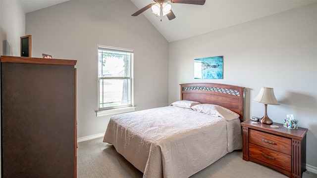 carpeted bedroom featuring ceiling fan and vaulted ceiling