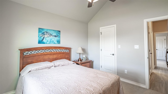 carpeted bedroom featuring ceiling fan and lofted ceiling