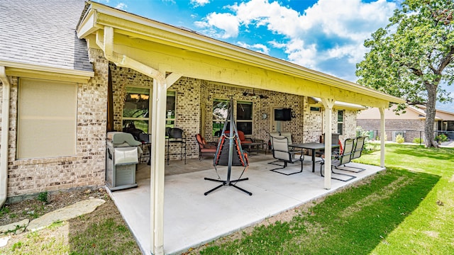 view of patio with a grill