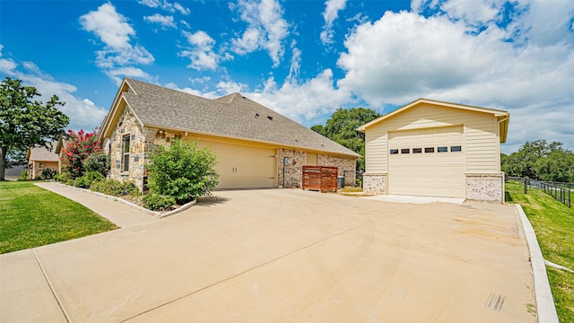 view of front facade with a garage and a front lawn