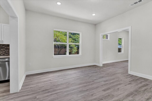 interior space with recessed lighting, visible vents, baseboards, and light wood-style floors