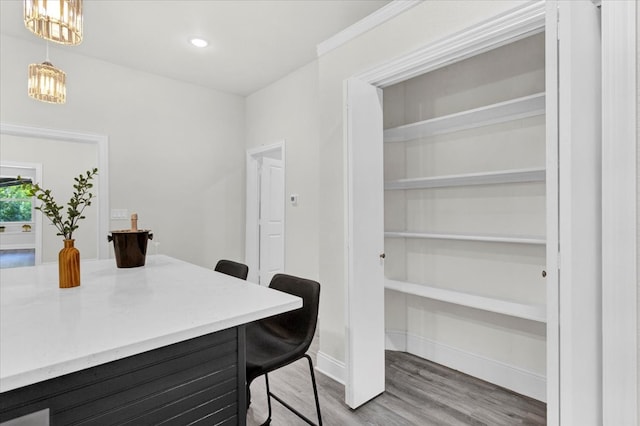 office area with recessed lighting, a notable chandelier, wood finished floors, and baseboards