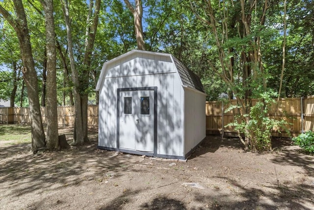 view of shed with a fenced backyard