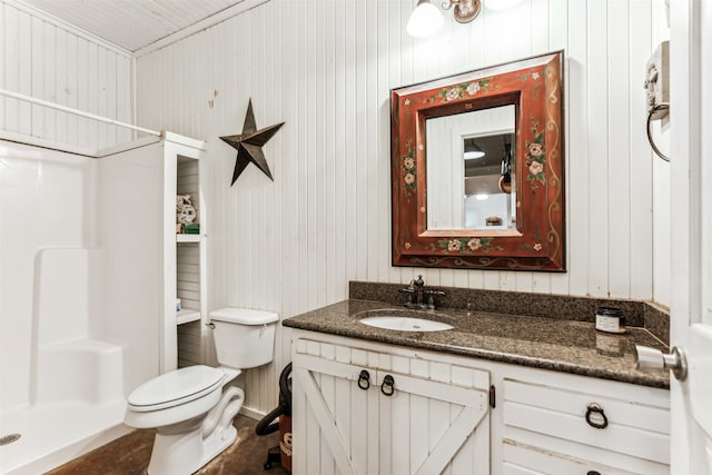 bathroom with a shower, wooden walls, vanity, and toilet