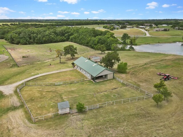 birds eye view of property with a rural view