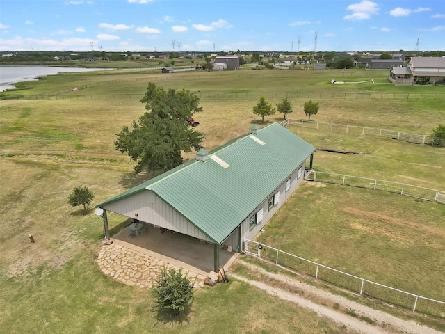 birds eye view of property with a water view and a rural view