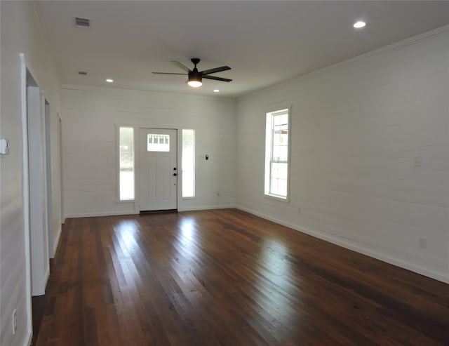 entrance foyer with ceiling fan, crown molding, and dark hardwood / wood-style flooring