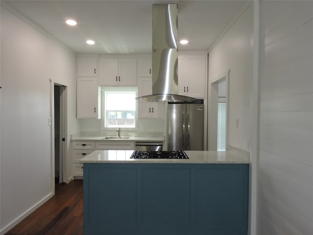 kitchen featuring stainless steel appliances, white cabinets, sink, island range hood, and dark wood-type flooring