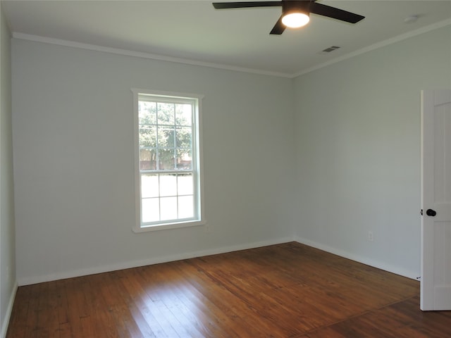 unfurnished room with dark wood-type flooring, ornamental molding, and ceiling fan