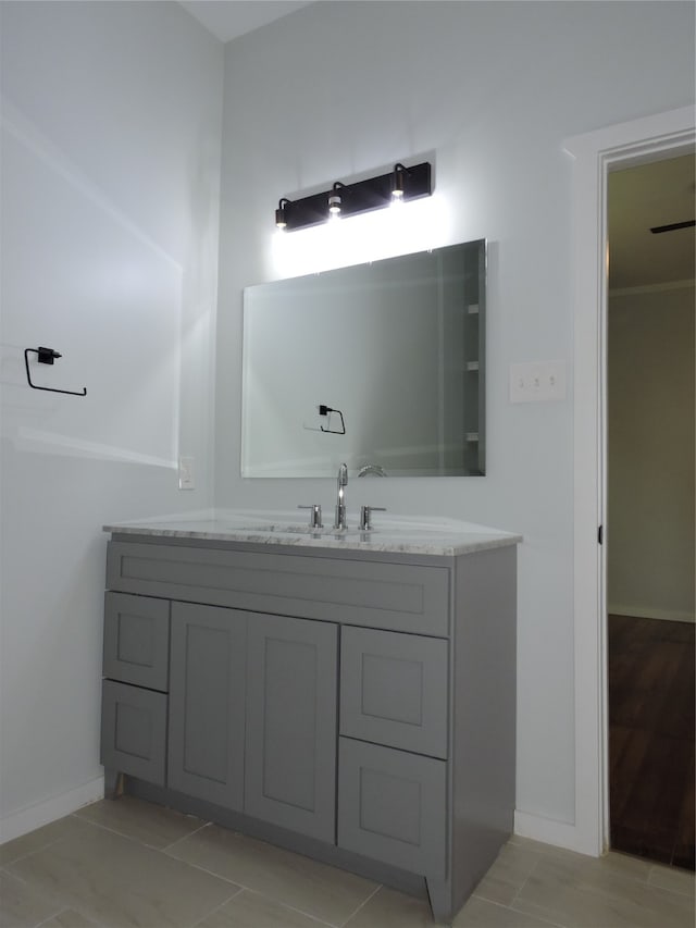 bathroom with vanity and hardwood / wood-style floors